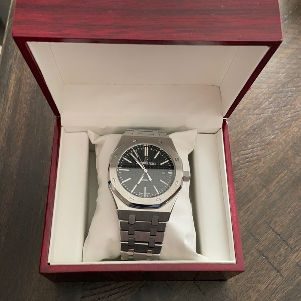 Audemars Piguet Royal Oak with Black Face.